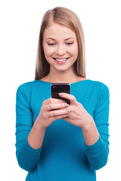 Woman holding the mobile phone - Photo, image