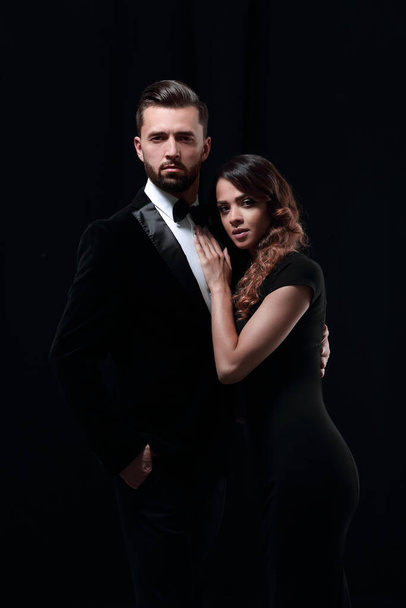 "portrait of fashion couple on black background" - Foto, afbeelding