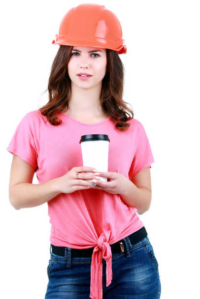 "Young female builder with helmet and coffee" - Foto, Imagem