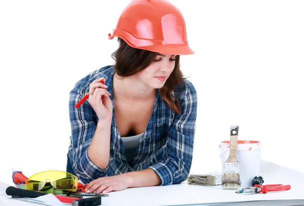 "Jonge bouwer vrouw met gereedschap" - Foto, afbeelding