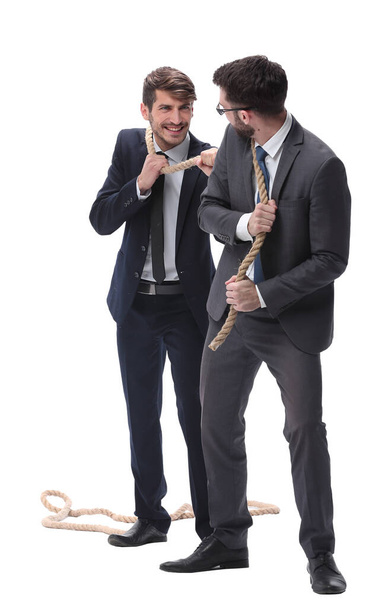 two businessmen pulling a long rope. - 写真・画像