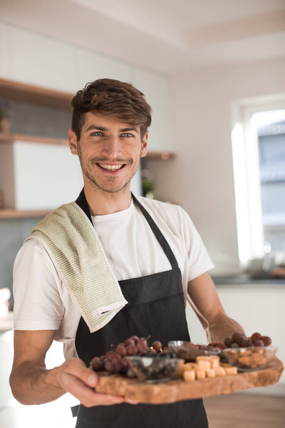 "attractive young man showing them cooked Breakfast" - Photo, Image