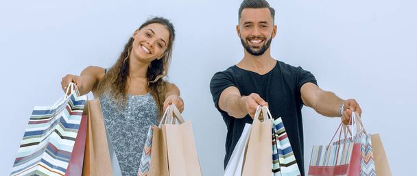 young couple shows shopping bags - Photo, Image
