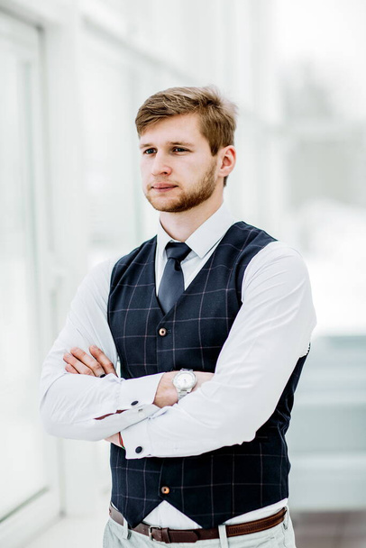 "thoughtful beginner businessman standing near window with hands" - Photo, Image