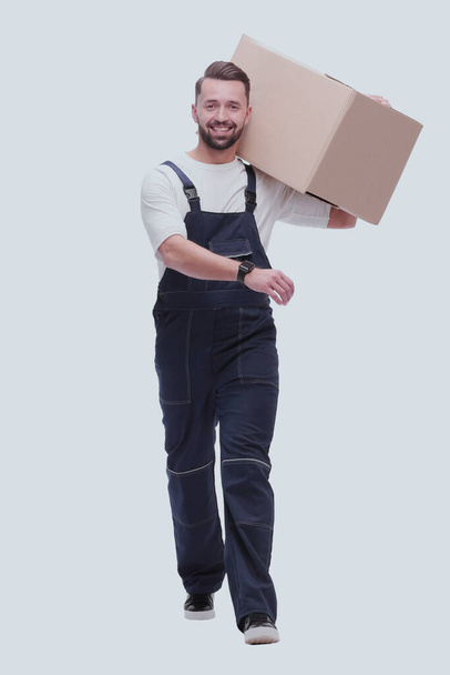 "em pleno crescimento. sorridente homem carrega uma grande caixa de papelão" - Foto, Imagem