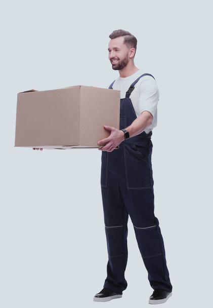 "rear view. a young man with a cardboard box looking at the camera" - Photo, Image