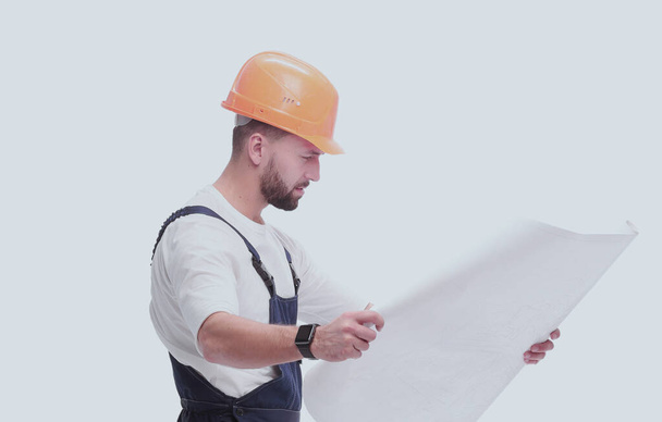"competent foreman Builder looking at drawings. isolated on white" - Φωτογραφία, εικόνα