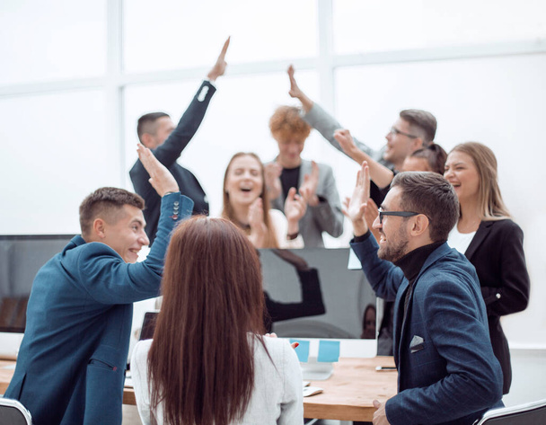 "group of young business people giving each other a high five" - Photo, Image