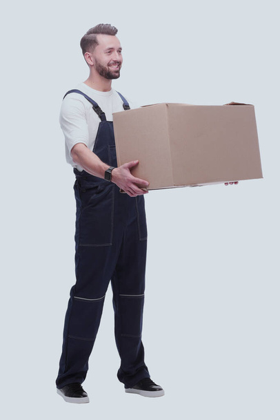 "rear view. a young man with a cardboard box looking at the camera" - Photo, Image