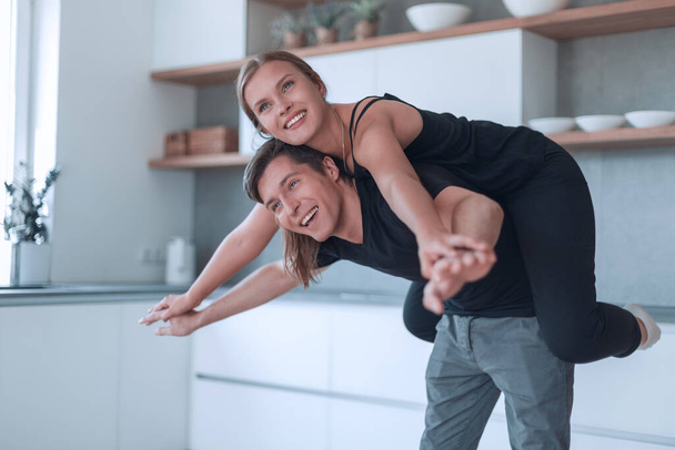 loving young couple having fun in their kitchen. - Fotoğraf, Görsel