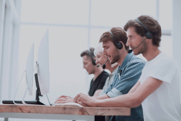 group of people in the headset works on personal computers. - Photo, Image