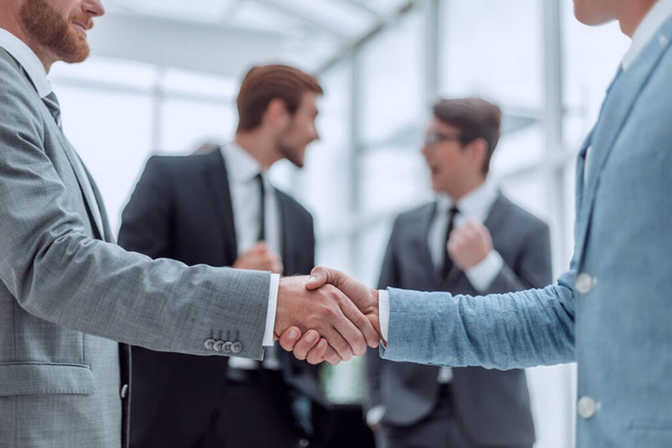business partners shaking hands in the office - Photo, Image