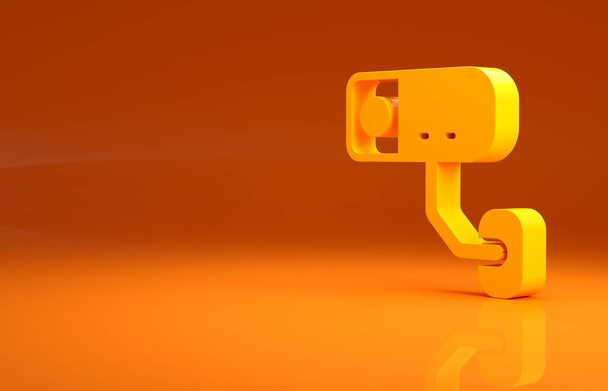 Sárga biztonsági kamera ikon elszigetelt narancssárga alapon. Minimalizmus koncepció. 3d illusztráció 3D render . - Fotó, kép