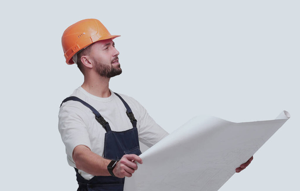 "competent foreman Builder looking at drawings. isolated on white" - Foto, Bild