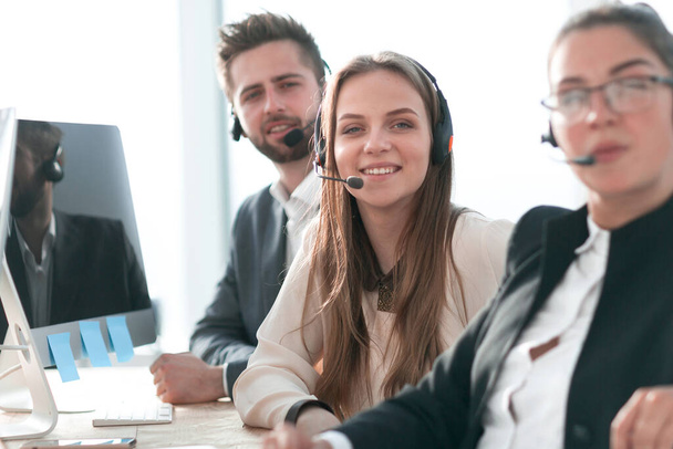 "employees in a headset sitting at an office Desk." - Photo, Image