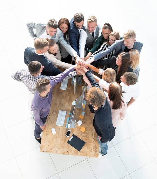 close up. group of young business people putting their palms together. - Photo, Image