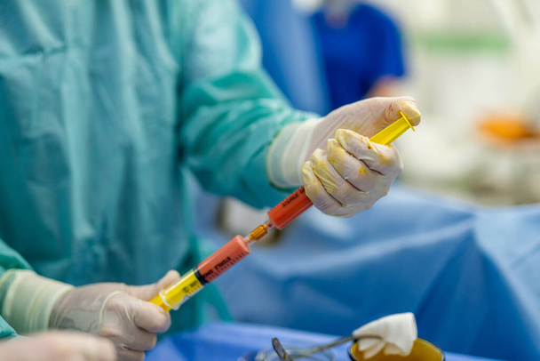 Modern technologies for plastic surgery. Operating surgery specialist preparining. - Fotó, kép