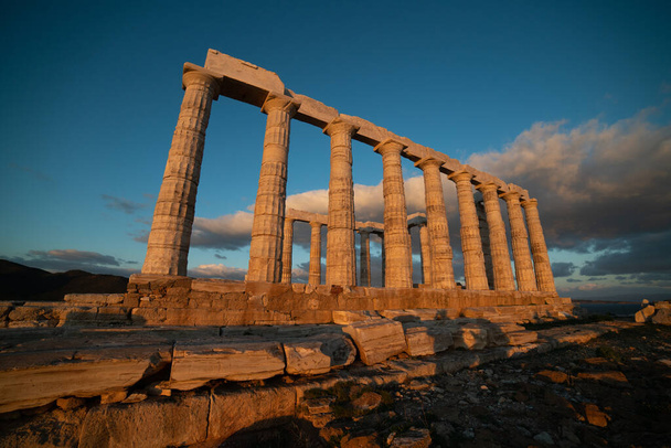 Sounion, Temple of Poseidon in Greece, under the light of sunset - Фото, изображение