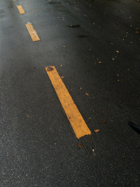 Road texture with yellow and dashed white stripe - Photo, Image