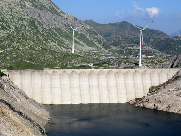 The dam Lucendro or concrete dam on the reservoir lake Lago di Lucendro in the Swiss alpine area of the St. Gotthard Pass (Gotthardpass), Airolo - Canton of Ticino (Tessin), Switzerland (Schweiz) - Photo, Image
