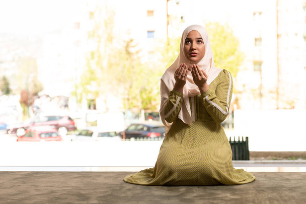 Humble Muslim Woman Holding Hands Up and Praying in Peace - Фото, зображення