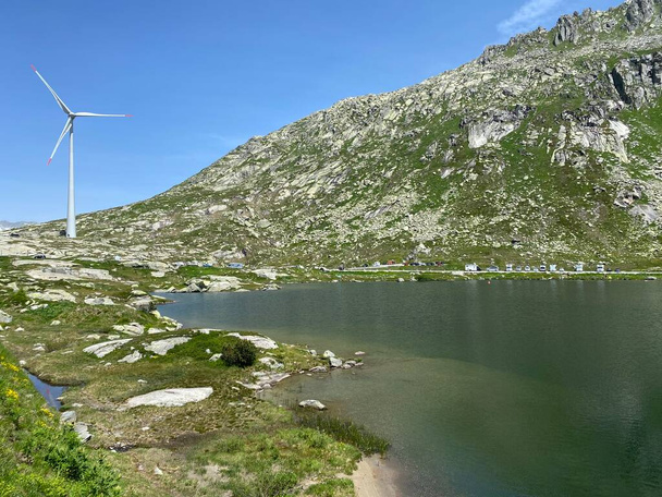 Summer atmosphere on the Lago della Piazza lake (Lake of the Piazza) in the Swiss alpine area of the mountain St. Gotthard Pass (Gotthardpass), Airolo - Canton of Ticino (Tessin), Switzerland (Schweiz) - Photo, Image
