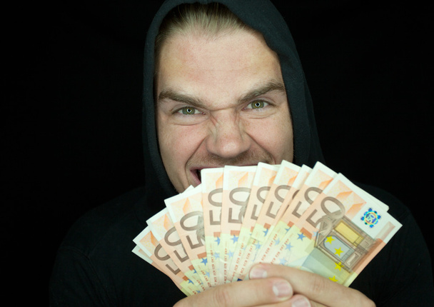 Ladrão com dinheiro
 - Foto, Imagem