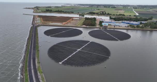 Floating rotating turnable solar panels. Large scale Sustainable energy generation solar system. Green electricity power extraction from the sun on inland water pool float. - Footage, Video