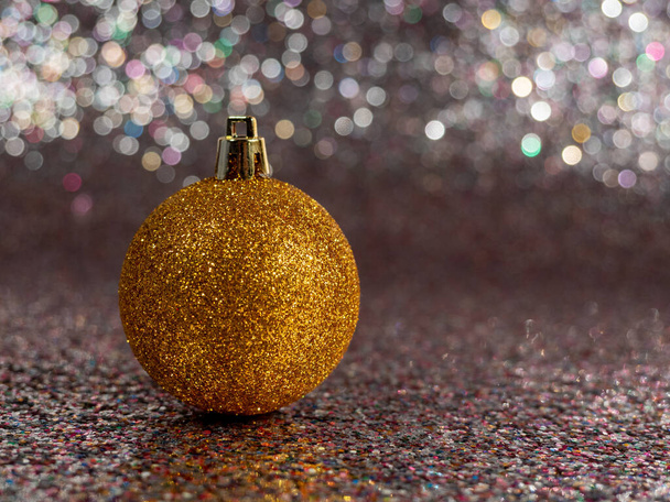 Christmas balls on a silvery background. Christmas decoration with beautiful bokeh. Multicolored balls. - Foto, Imagem
