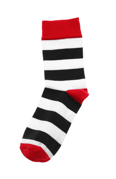 Striped sock isolated on white, top view - Fotó, kép