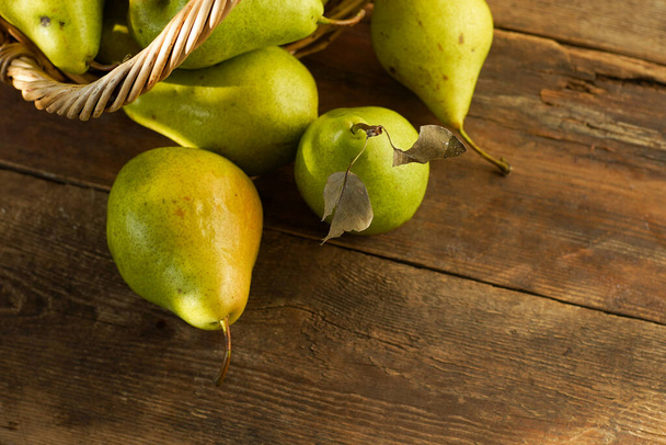 Pears on a wooden background. Fruit harvest. Autumn still life. Pear variety Bera Conference. - Foto, immagini