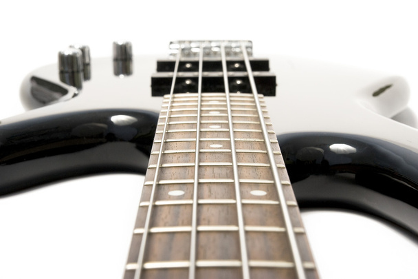 Black bass guitar with strained strings - Φωτογραφία, εικόνα