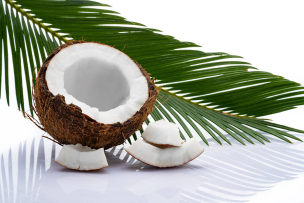 Coconut with leaves on white background - Фото, зображення