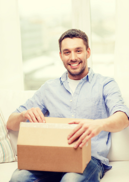 man with cardboard boxes at home - Foto, Imagen