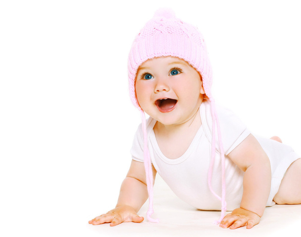 Funny baby in knitted hat playing - Photo, Image