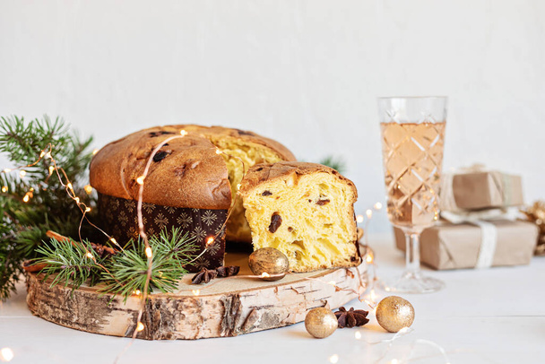 Panettone, traditional italian Christmas sweets for winter holidays celebration. Cristmas desert, festive dinner concept - Photo, Image