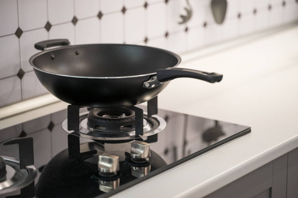 Gas stove and wok in the kitchen - Photo, image