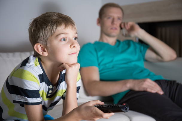 Schoolboy addicted to watching tv - Foto, Imagen