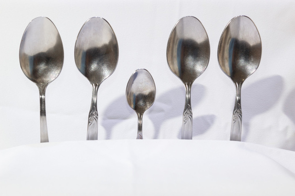 Spoons and forks, small spoons on a white background - Photo, Image