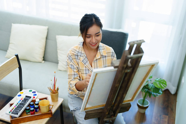 Portrait of an Asian woman designing art in her spare time - Foto, imagen