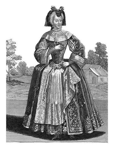 Une figure féminine avec des ciseaux et un tas de clés sur sa ceinture. - Photo, image
