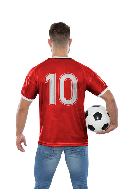 Soccer fan man with number ten in red jersey the national team of Switzerland with ball in hands on white background. - Foto, afbeelding
