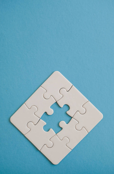 Jigsaw puzzle pieces forming partial figure. - Fotoğraf, Görsel