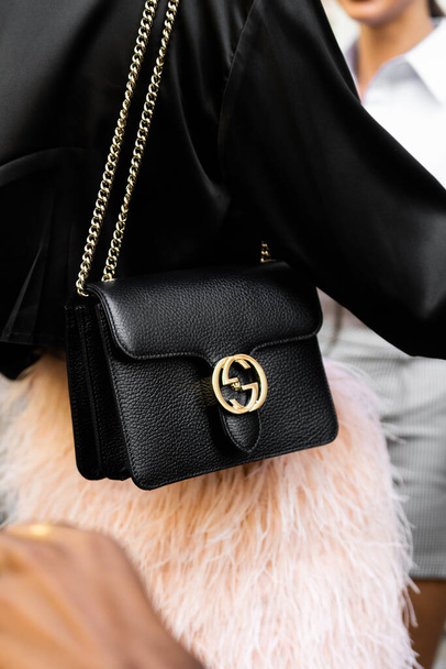 Milan, Italy - September, 21, 2022: Stylish woman wearing black dollar calfskin small interlocking G shoulder bag from Fendi, street style outfit details - Foto, Bild