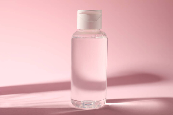 Bottle of micellar water on pink background - Foto, Imagem