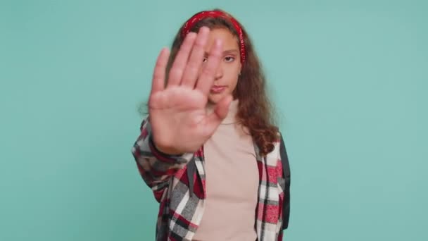Stop gesture. Angry young preteen child girl kid say No hold palm folded crossed hands, warning of finish, prohibited access, declining communication, body language, danger. Little serious children - Footage, Video
