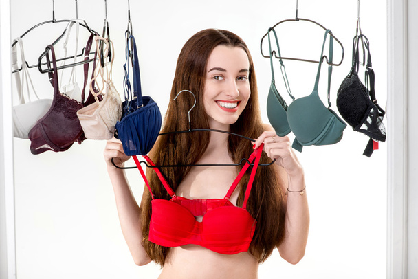 Woman choosing bras - Photo, Image