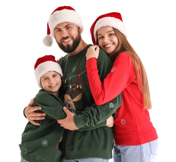 Happy parents with their little son in Santa hats on white background - Photo, Image