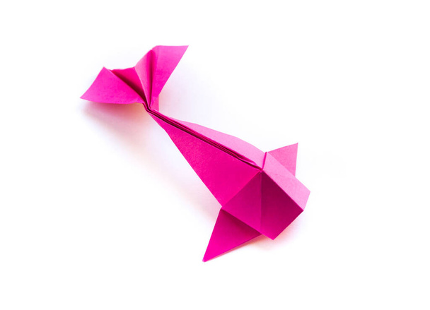 Pink paper fish origami isolated on a blank white background - Photo, image
