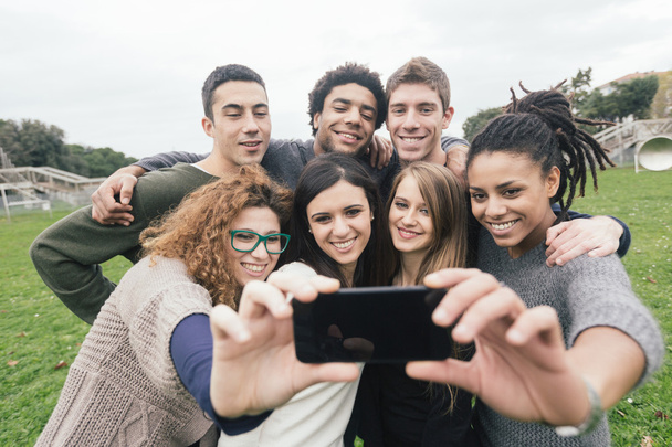 Multiethnic Group of Friends Taking Selfie at Park - Photo, Image